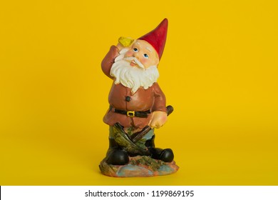 Garden Gnome Isolated On Yellow Background