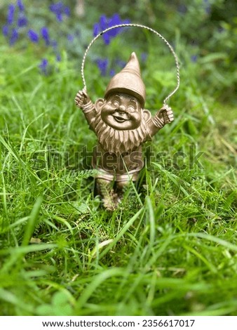 A garden gnome jumping rope
