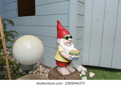 garden gnome with a red cap and glasses