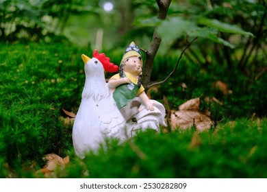 Garden gnome sitting on a rooster figurine in green forest scene in the Netherlands - Powered by Shutterstock