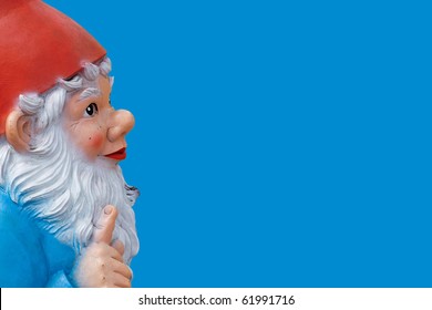 Garden Gnome With A Wagging Finger Isolated On Blue