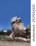 Garden of the Gods, on the Turquoise Trail in New Mexico, has giant rocky monliths.  Blue sky shines overhead.