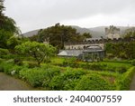 Garden with greenhouse Glenveagh Castle a large country house built in the 1870s in County Donegal, Ireland 