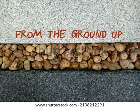 Garden ground with handwritten text FROM THE GROUND UP, concept of start doing or learning from the very beginning, start from scratch, start business from the basic or foundation
