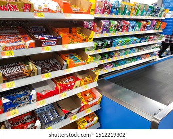 Garden Grove, California, United States - 09-20-2019: Impulse buys at the checkout lane, featuring candy bars and gum.