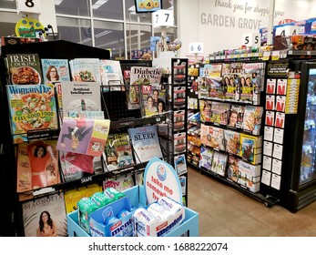 Garden Grove, California, United States - 03-16-2020: A View Several Options Of Impulse Entertainment Magazines, On Display At The Checkout Lane Of A Local Grocery Store.