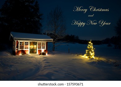 The Garden House And The Christmas Tree  With Its Lights And The Text Merry Christmas And Happy New Year