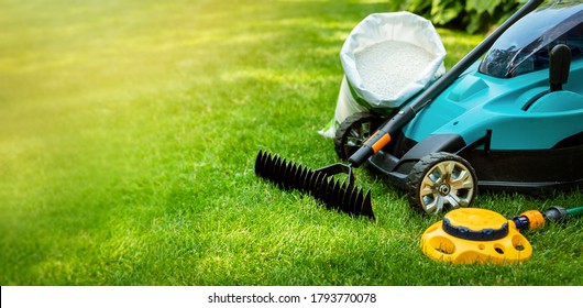 garden lawn care tools and equipment for perfect green grass. banner copy space