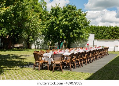 Garden Party Set Up For Lunch Dinner With Long Table, Decorated Table In The Garden