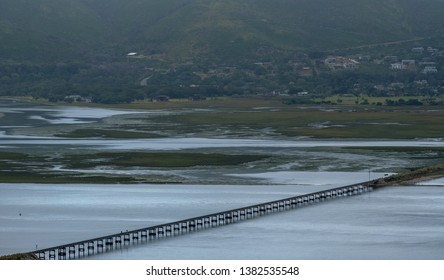 The Garden Route, South Africa: Water In The Estuary At Knysna Lagoon, With Bridge Carrying Train Lines Running Across The Water. 