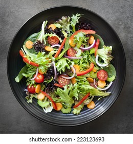 Garden Salad In Black Bowl.  Overhead View.