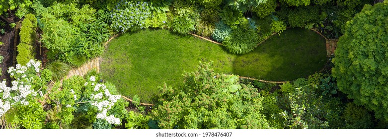 Garden Seen From Above With Flower Bed, Flowers And Green Plants. In Banner Format