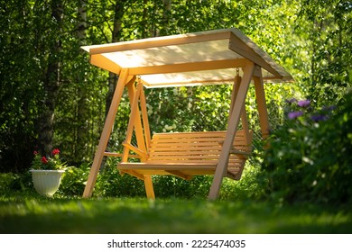 Garden swing with your own hands. Wooden swing for the garden. A place to relax and unwind in the summer garden.