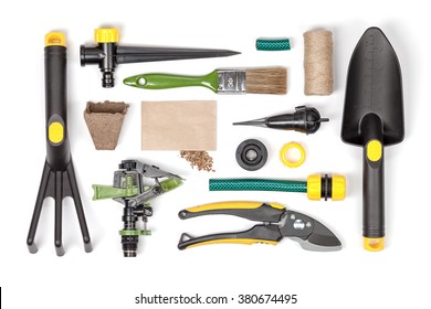 Garden Tools And Essentials On White Background Top View. Gardening Flat Lay Concept