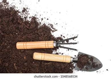 Garden Tools In Soil Isolated On White Background With Copy Space For Your Text. Top View