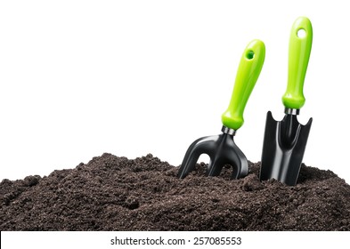 Garden Tools In Soil Isolated On White Background
