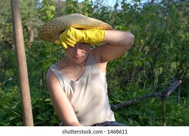 Garden Work - Tired Woman Mopping Sweat From Her Brow