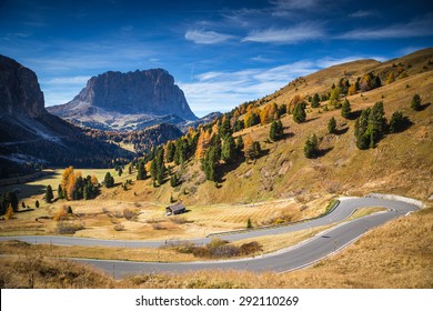 Gardena Pass, Trentino Alto Adige, Italy. The road descending from Gardena Pass, with Sassolungo mountain on the background.
