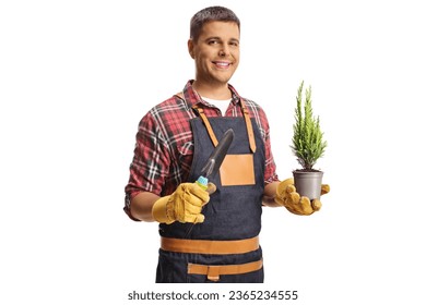 Gardener holding a small evergreen tree in a pot and hand pruners isolated on white background - Shutterstock ID 2365234555