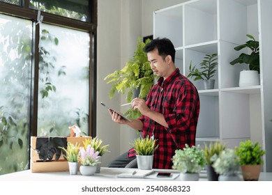 Gardener Using Tablet for Plant Care and Management - Powered by Shutterstock