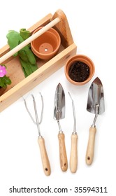 A Gardener's Tote Box On A White Background With Tools, Plants And Gloves