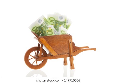 Gardening with euros in wheelbarrow isolated over white background