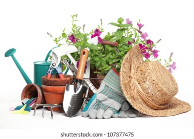 Gardening Tools And Flowers Isolated On White.