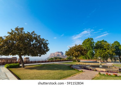 Gardens at the Jaswant Thada with the Mehrangarh Fort in the background.