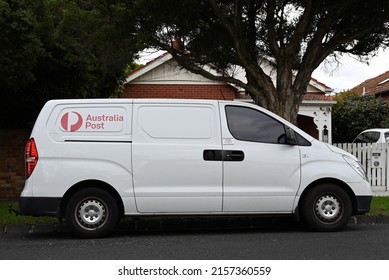 Gardenvale, Victoria, Australia - May 17 2022: Side View Of An Australia Post Delivery Van, A Hyundai ILoad, Stopped On A Suburban Street, With A Home In The Background