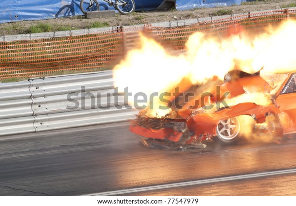 GARDERMOEN RACEWAY,
NORWAY - MAY 14: Race car explodes into flames during a drag race
on May 14,2011 at Gardermoen Raceway, Norway. The car disintegrates
in a ball of fire.