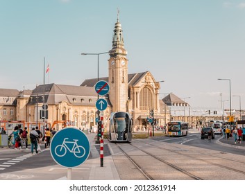Gare, Luxembourg - July 21, 2021 - bicycle sign in front of central railway station with tramway train