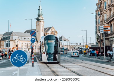 Gare, Luxembourg - July 21, 2021 - street shot of bicycle sign in front of central railway station with tramway train
