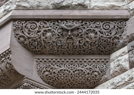 Gargoyle and intricate stone work. Colonial architectural feature or detail in Old City Hall Building (1898), Toronto, Canada
