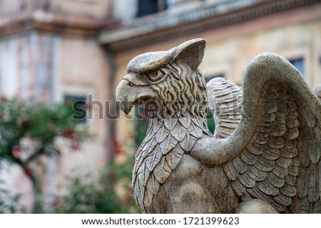 Gargoyle statue, chimeras, in the form of a medieval winged monster, from the royal castle in Bana hill, tourism site in Da Nang, Vietnam. Gothic old vintage gargoyle in a french village near Danang