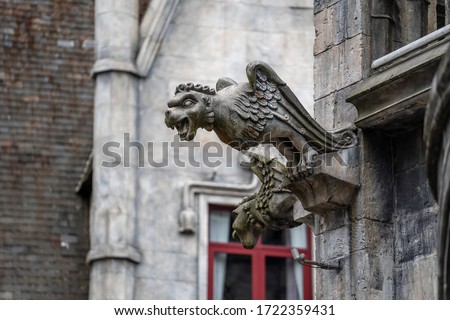 Gargoyle statue, chimeras, in the form of a medieval winged monster, from the royal castle in Bana hill, tourism site in Da Nang, Vietnam. Gothic old vintage gargoyle in a french village near Danang