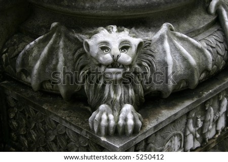 gargoyle statue on pillar