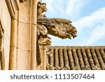 Gargoyle of a winged lion that represents Saint Mark, in San Juan de los Reyes monastery in Toledo, Spain.