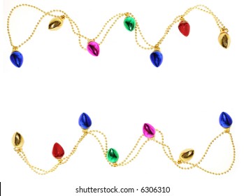 A Garland Of Christmas Lights On Gold Beads Form Top And Bottom Border On White Background