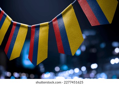 A garland of Colombia national flags on an abstract blurred background. - Powered by Shutterstock