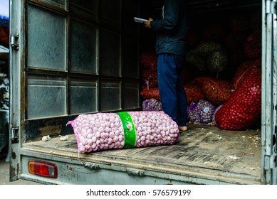 Garlic Bag On Delivery Truck At Market, Transport Goods