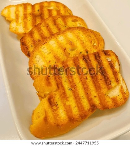 Garlic Bread garlic bread is loaded with healthy fibre n nutrients occasionally olive oil or butter and may include additional herbs,such as oregano or chives It is then either grilled until toasted 