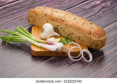 Garlic Bread Loaf On Wooden Plate