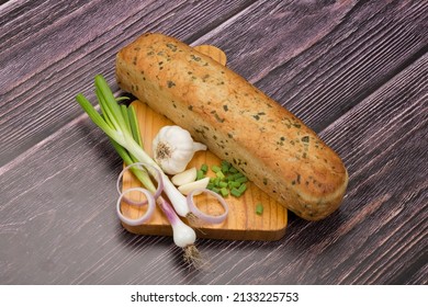 Garlic Bread Loaf On Wooden Plate