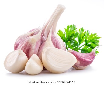 Garlic bulb, garlic cloves and parsley isolated on white background. - Shutterstock ID 1139824115