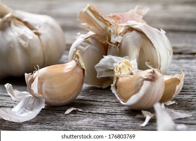 Garlic Bulb On Old Wooden Table