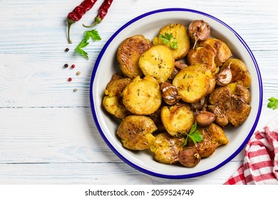 Garlic Butter Parmesan Smashed Baked Potatoes. Top View, Copy Space.