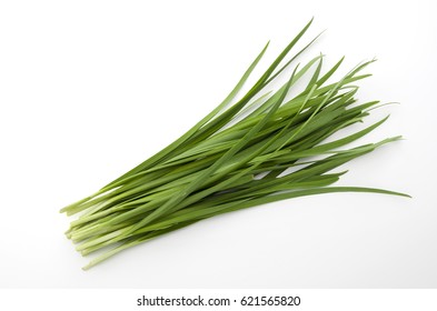 Garlic chives isolated on white background - Shutterstock ID 621565820
