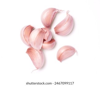 Garlic cloves isolated on white background. Top view, flat lay.