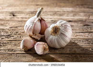 Garlic Cloves On Wooden Table