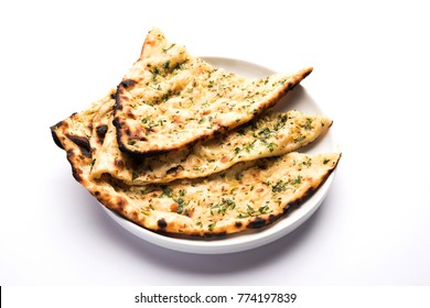 Garlic and coriander naan served in a plate, it's a type of Indian bread or roti flavoured with Lahsun